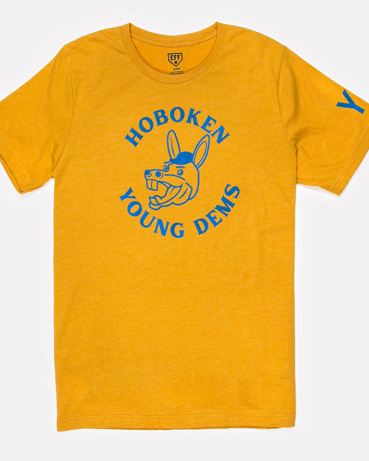 The Hoboken Young Democrats T-Shirt by Ebbets Field Flannels is a yellow unisex tee featuring blue “Hoboken Young Dems” text, a cartoon donkey head on the front, and a sporty blue “Y” on the left sleeve.